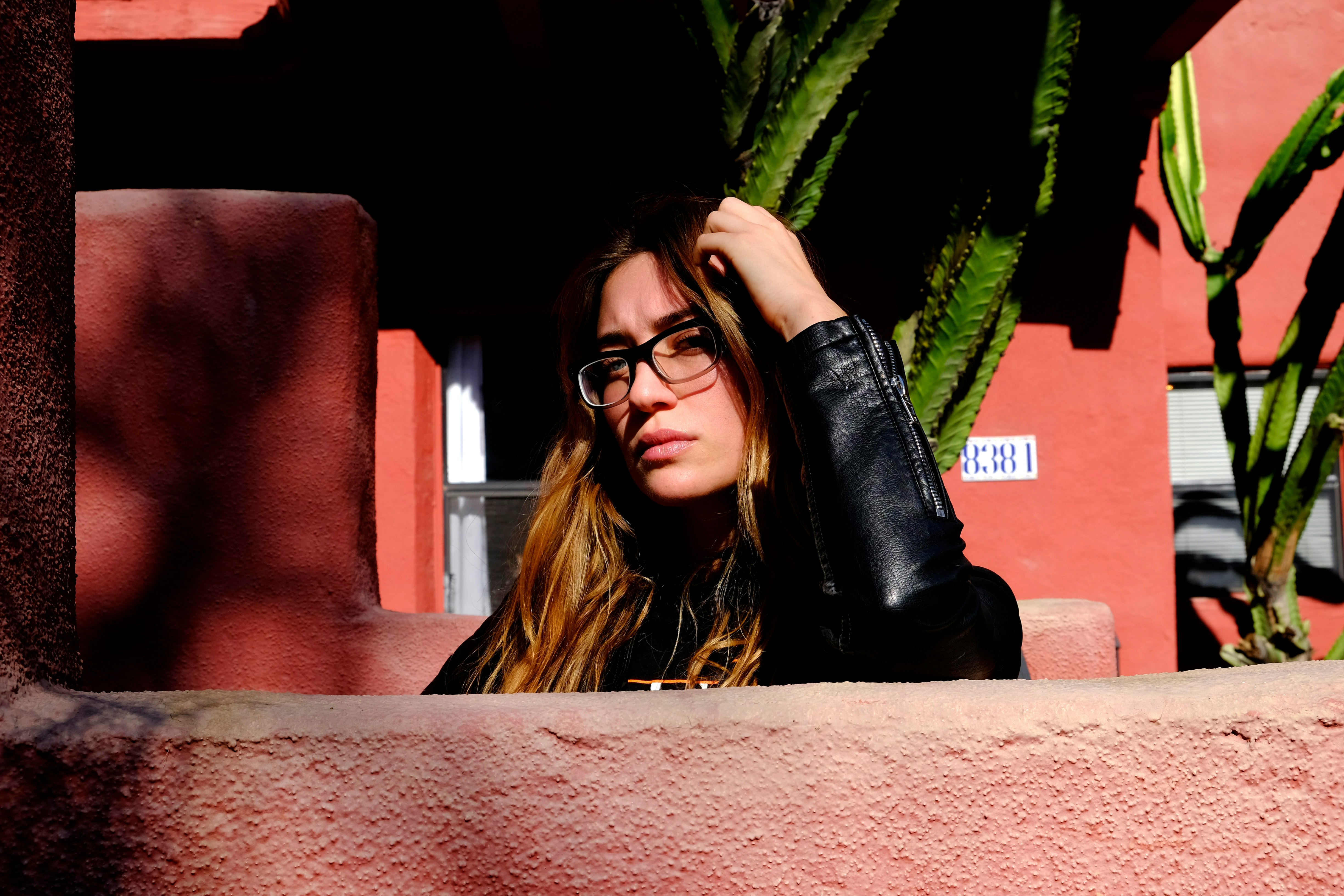 woman wearing black leather jacket